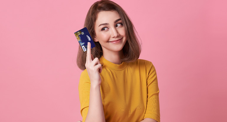 Woman holding debit card