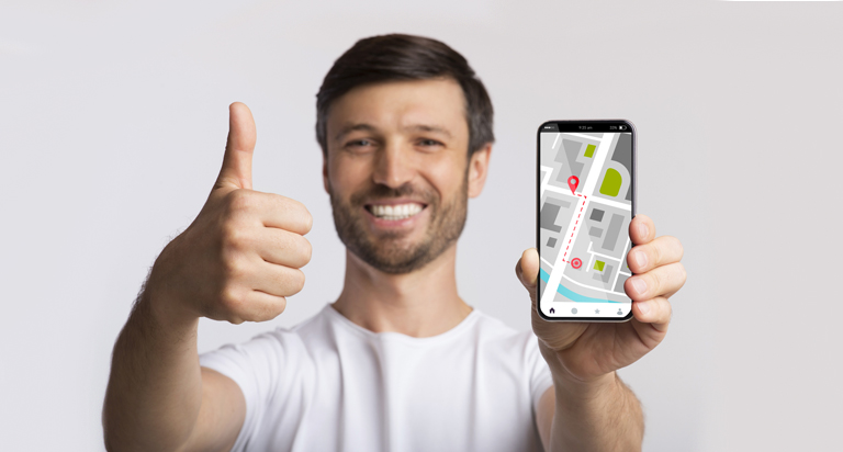 Man holding phone showing map