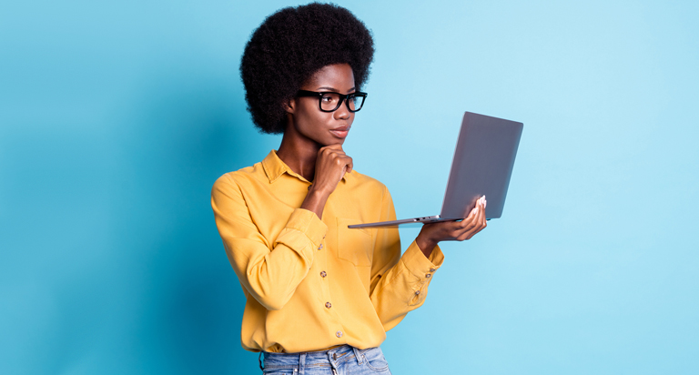 Woman looking at laptop