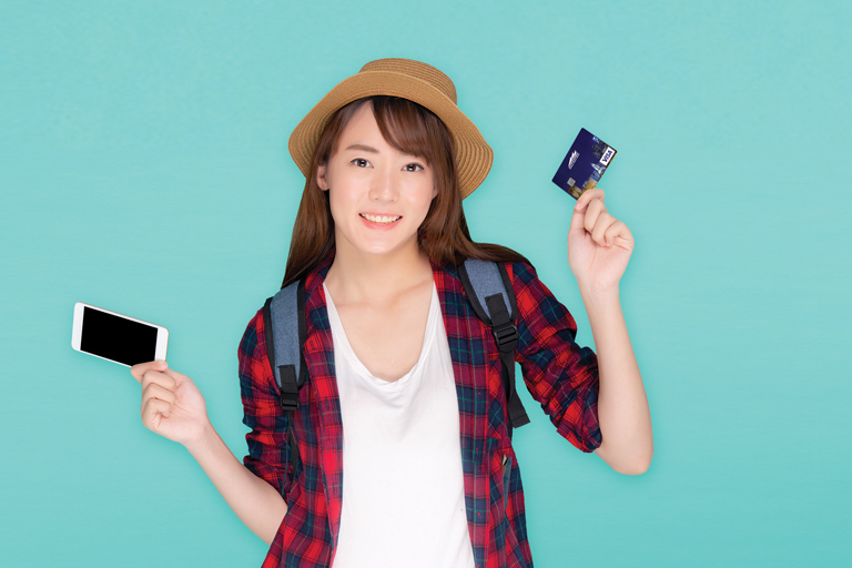 Teen holding credit cards