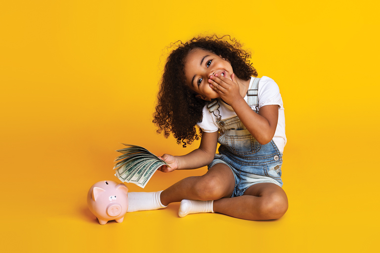 Child holding piggy bank