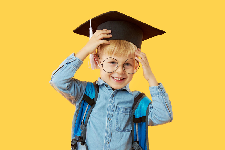 Child wearing graduation cap