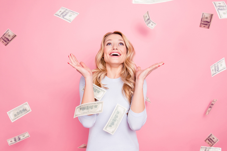 Woman smiling with cash