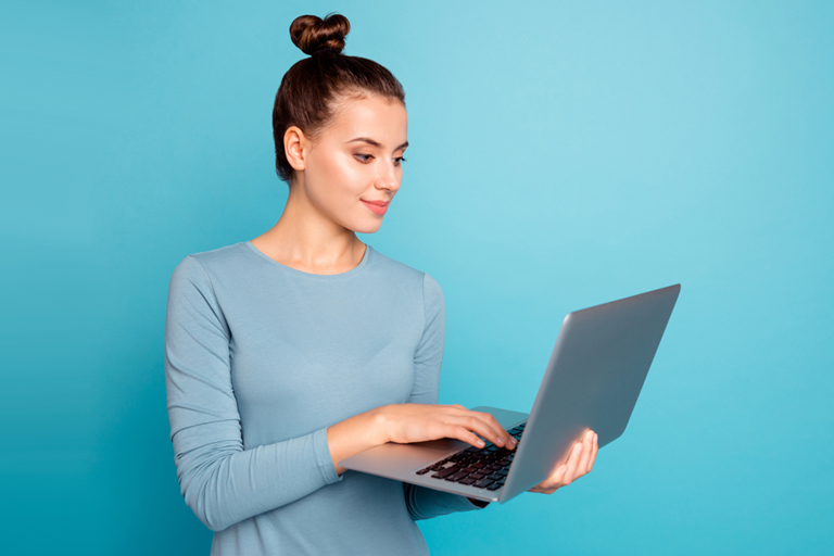 Woman typing on a laptop