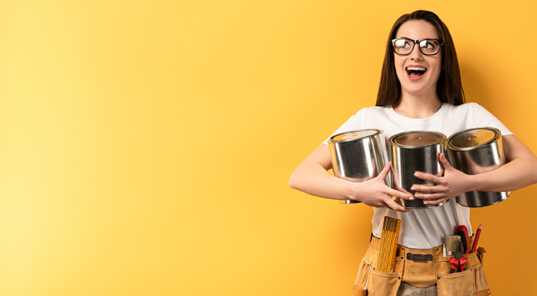 Woman holding paint cans