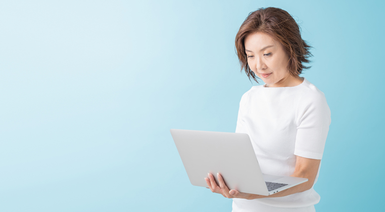 Woman looking at laptop