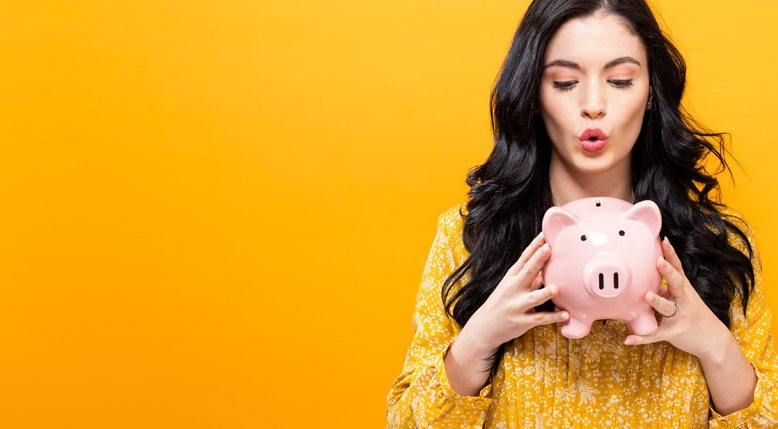 Woman holding piggy bank